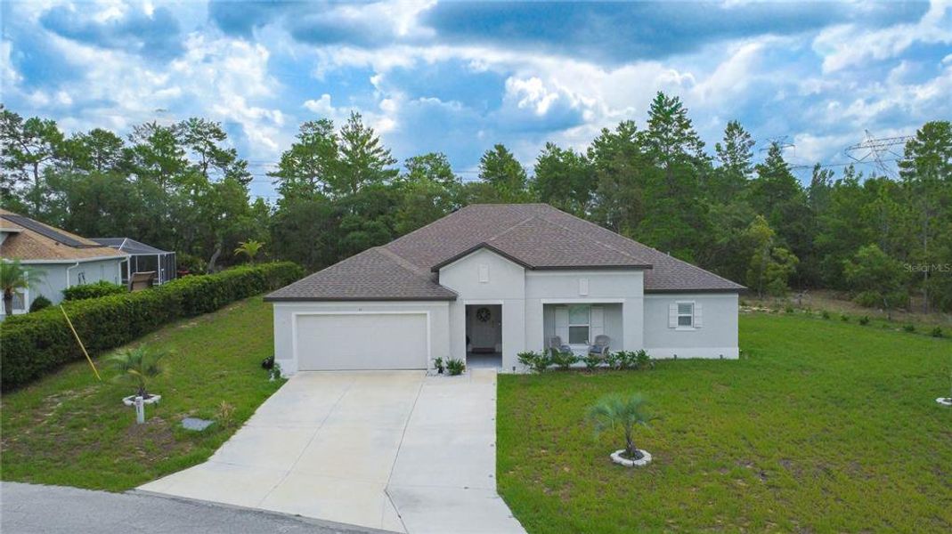 Front exterior of a new home in , Homosassa, FL, highlighting curb appeal (Image 23). Front exterior of a new home in , Homosassa, FL, highlighting curb appeal (Image 23).