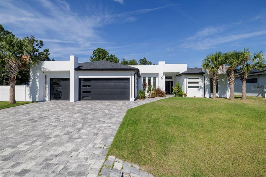 Front exterior of a new home in , Palm Coast, FL, highlighting curb appeal (Image 28).