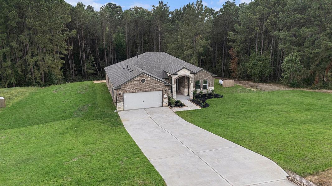 Front exterior of a new home in Rose Hill Estates, Willis, TX, highlighting curb appeal (Image 22).