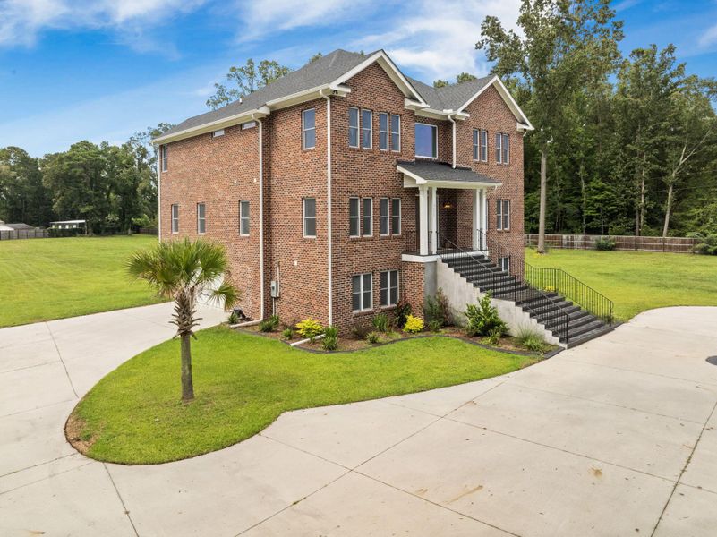 Front exterior of a new home in , Summerville, SC, highlighting curb appeal (Image 31). Front exterior of a new home in , Summerville, SC, highlighting curb appeal (Image 31).