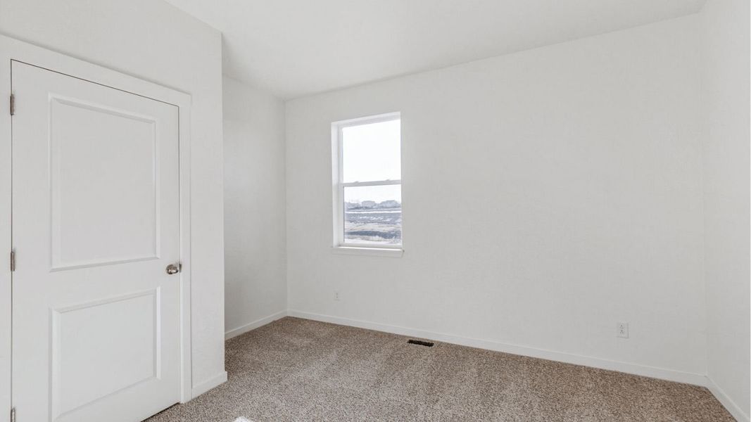 Representative unfurnished interior of a home built from the Elm by D.R. Horton in Granary, Johnstown (Image 12).