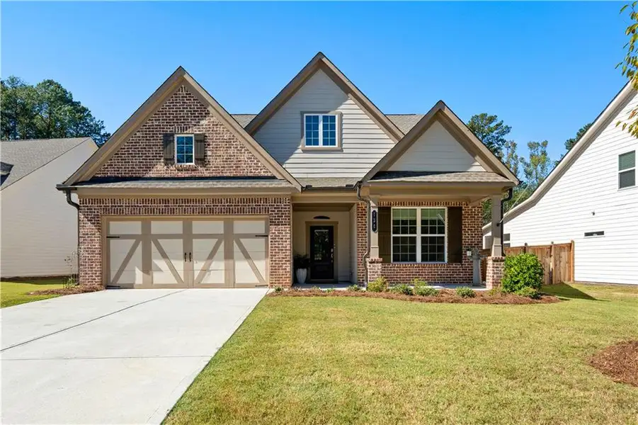 Front exterior of a new home in Candleberry Place, Sharpsburg, GA, highlighting curb appeal (Image 2).