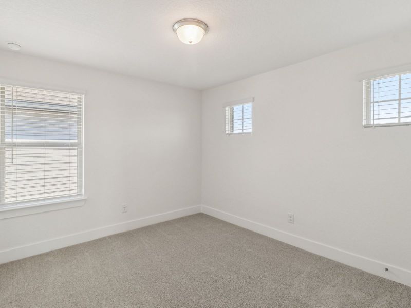 Guest bedroom in the Matador floorplan at a Meritage Homes community. Guest bedroom in the Matador floorplan at a Meritage Homes community.