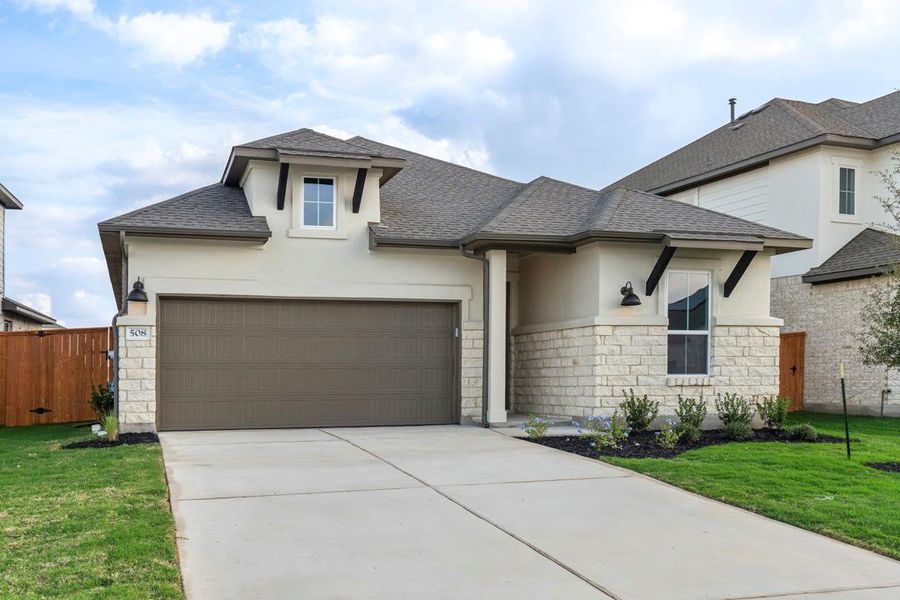 Front exterior of a new home in Lariat, Liberty Hill, TX, highlighting curb appeal (Image 20). Front exterior of a new home in Lariat, Liberty Hill, TX, highlighting curb appeal (Image 20).