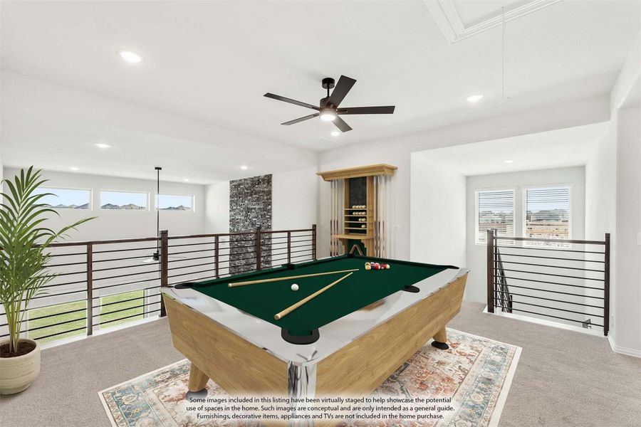 Open loft game room with pool table, ceiling fan, and metal railing overlooking lower level