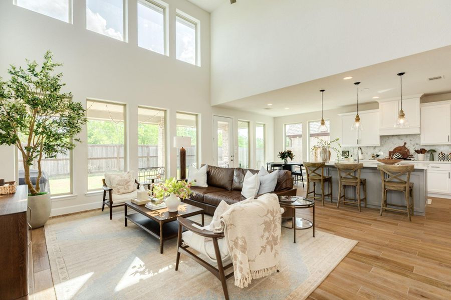 Open-concept floor plan seamlessly connecting the spacious family room to the kitchen, complete with a functional breakfast bar and cozy breakfast nook. Open-concept floor plan seamlessly connecting the spacious family room to the kitchen, complete with a functional breakfast bar and cozy breakfast nook.