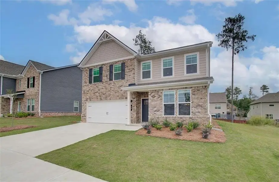 Front exterior of a new home in Westminster, Covington, GA, highlighting curb appeal (Image 15).