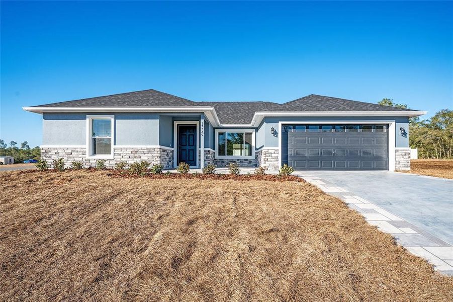 Front exterior of a new home in , Ocklawaha, FL, highlighting curb appeal (Image 18).