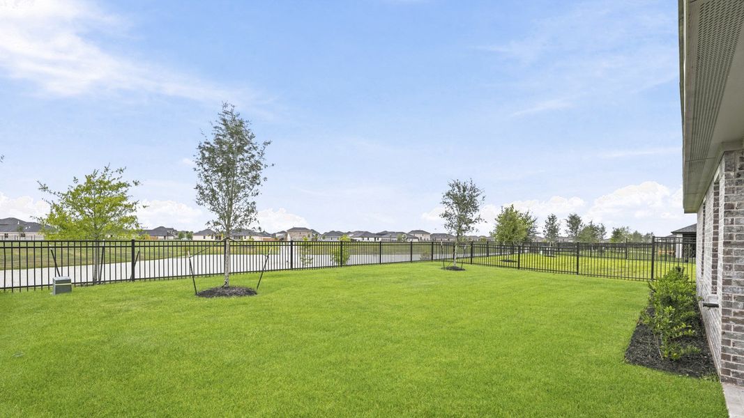 Exterior details and patio area of a home in Sunterra, Katy (Image 3).