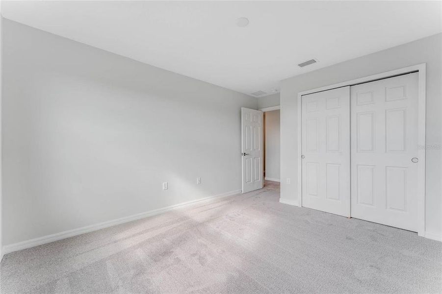 Spacious, unfurnished interior of a new home in Covered Bridge at Liberty Bluff, Haines City (Image 26).
