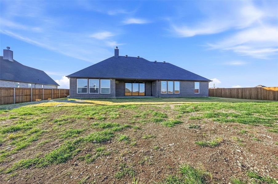 Exterior details and patio area of a home in Coyote Crossing, Godley (Image 28).