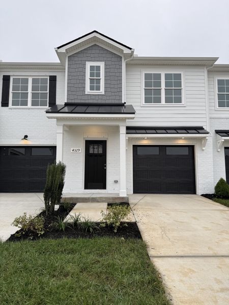 Front exterior of a new home in Jackson Towne, Murfreesboro, TN, highlighting curb appeal (Image 1).