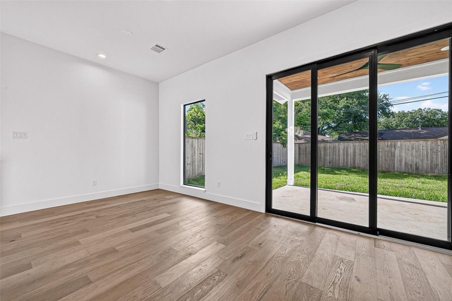 Large sliding doors that lead out to back patio Large sliding doors that lead out to back patio