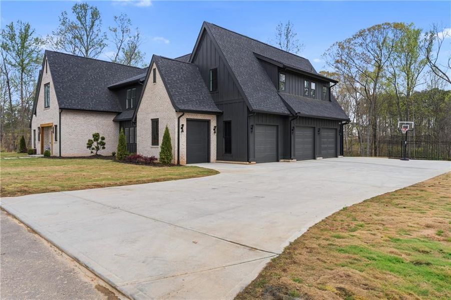 Front exterior of a new home in , Dacula, GA, highlighting curb appeal (Image 24).
