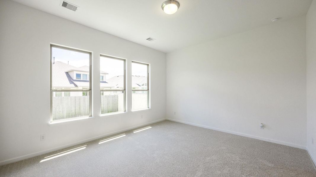 Spacious, unfurnished interior of a new home in Santa Rita Ranch - Tierra Rosa, Liberty Hill (Image 13).