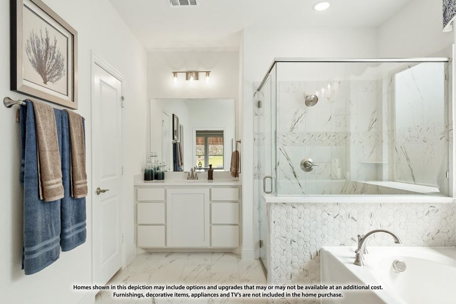 Bathroom with white vanity, glass-enclosed shower, soaking tub, and marble tile walls and floors Bathroom with white vanity, glass-enclosed shower, soaking tub, and marble tile walls and floors