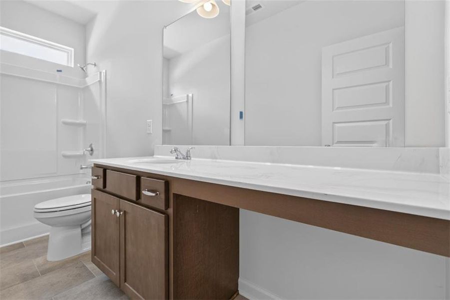 Furnished interior view inside a new home in Summerfield Place, Carrollton (Image 10).