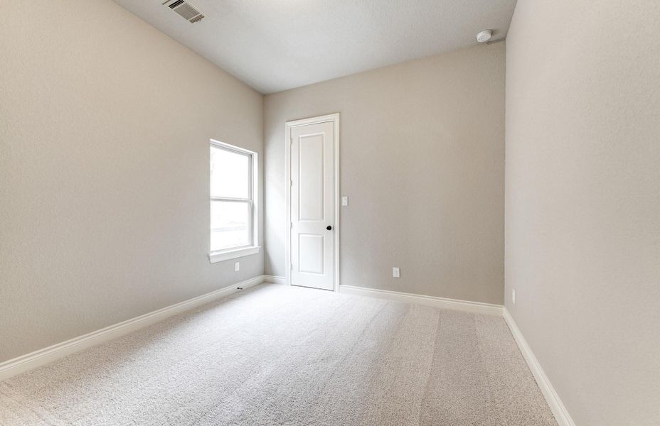 Spacious, unfurnished interior of a new home in The Woodlands Hills 65′, Willis (Image 23).