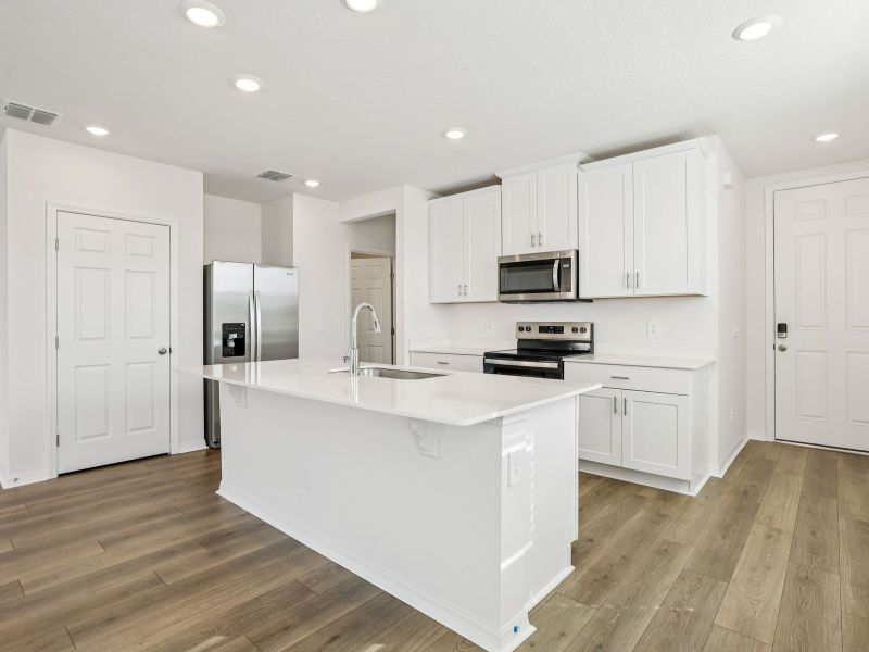 Furnished interior view inside a new home in The Meadow at Crossprairie Townes, St. Cloud (Image 3).
