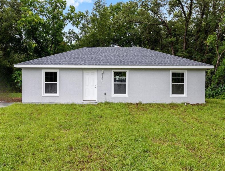 Front exterior of a new home in , Dunnellon, FL, highlighting curb appeal (Image 1). Front exterior of a new home in , Dunnellon, FL, highlighting curb appeal (Image 1).