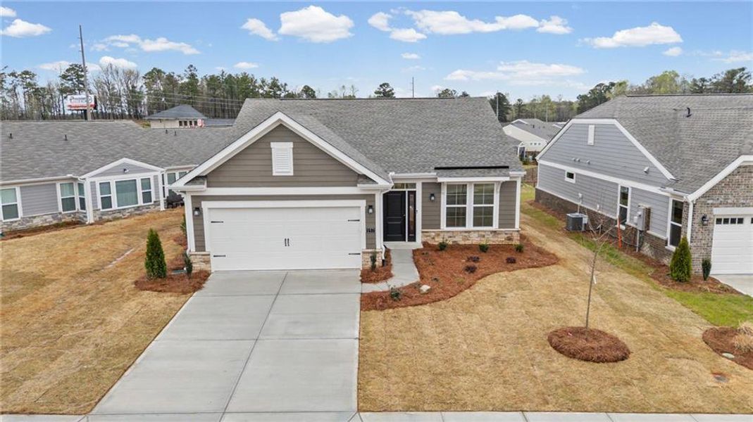 Front exterior of a new home in Laurel Farms, Dallas, GA, highlighting curb appeal (Image 21).