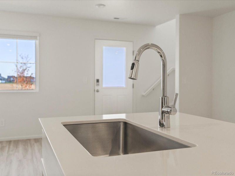 Furnished interior view inside a new home in Skyview at High Point, Aurora (Image 9).