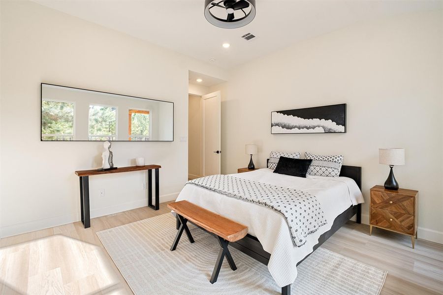 Bedroom featuring light wood-style flooring and recessed lighting