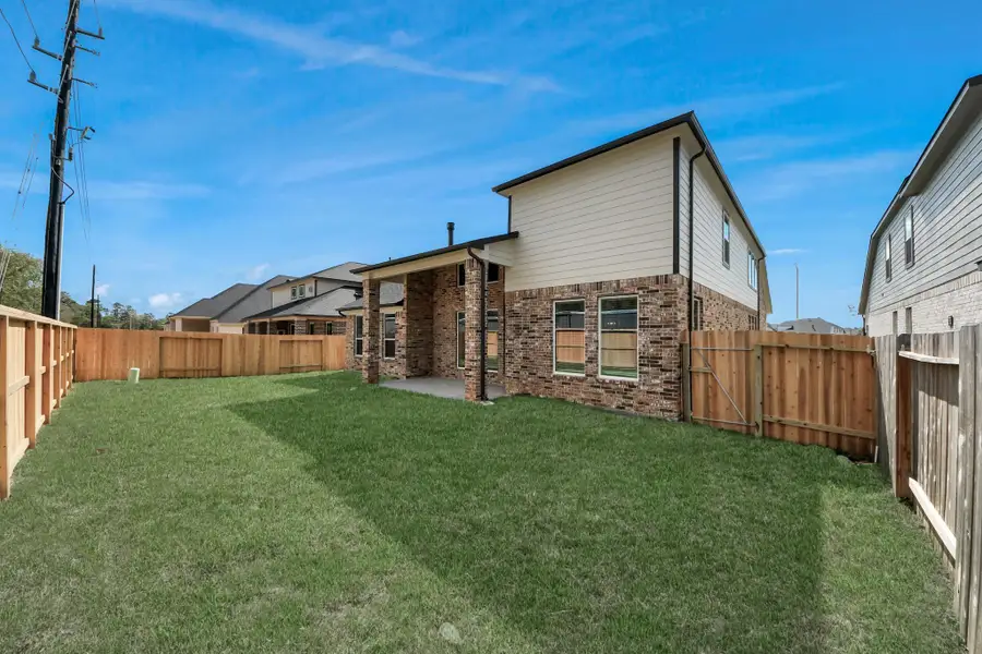 Come and see this spacious backyard with its beautiful covered patio. There is plenty of room for the kids to play and adults to relax. Perfect for your outdoor living space, patio furniture, bbq pit, and so much more. The possibilities are endless!Explore the expansive backyard with its inviting covered patio—a perfect blend of space for the kids to play and adults to unwind. Ideal for creating your outdoor oasis, this backyard accommodates patio furniture, a BBQ pit, and endless possibilities for leisur