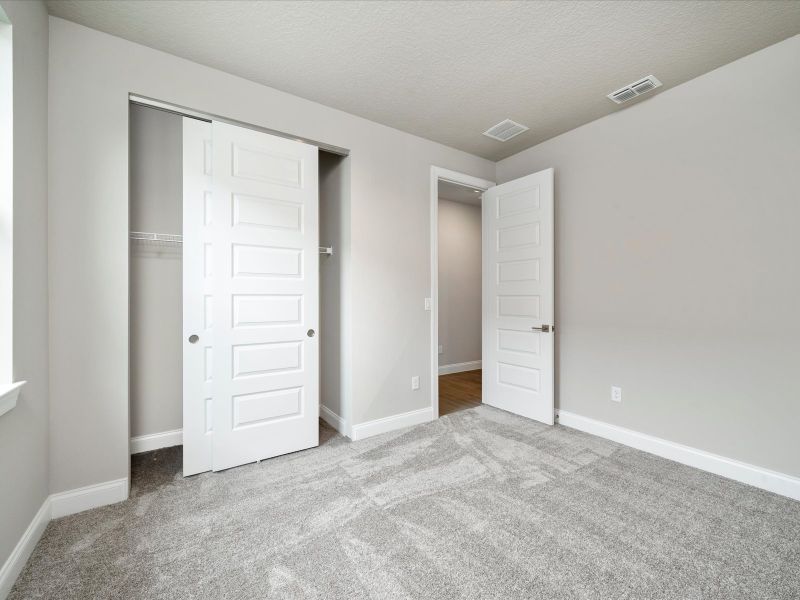 Bedroom in the Onyx floorplan at 6383 NW Sweetwood Drive in Brystol at Wylder