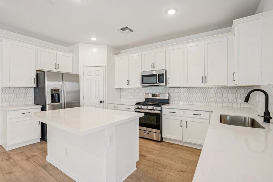 Kitchen featuring the Harmony Collection. Not actual home, finishes may vary by community.
