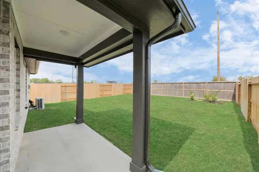 Exterior details and patio area of a home in , Tomball (Image 4).