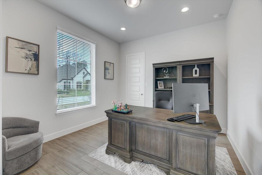 French doors open to a 13×12 office with an 11' ceiling and recessed lighting, offering a bright, polished workspace that can easily serve as a 5th bedroom thanks to its walk-in closet.