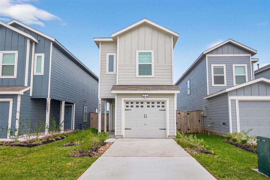 Front exterior of a new home in Tavola, New Caney, TX, highlighting curb appeal (Image 2). Front exterior of a new home in Tavola, New Caney, TX, highlighting curb appeal (Image 2).