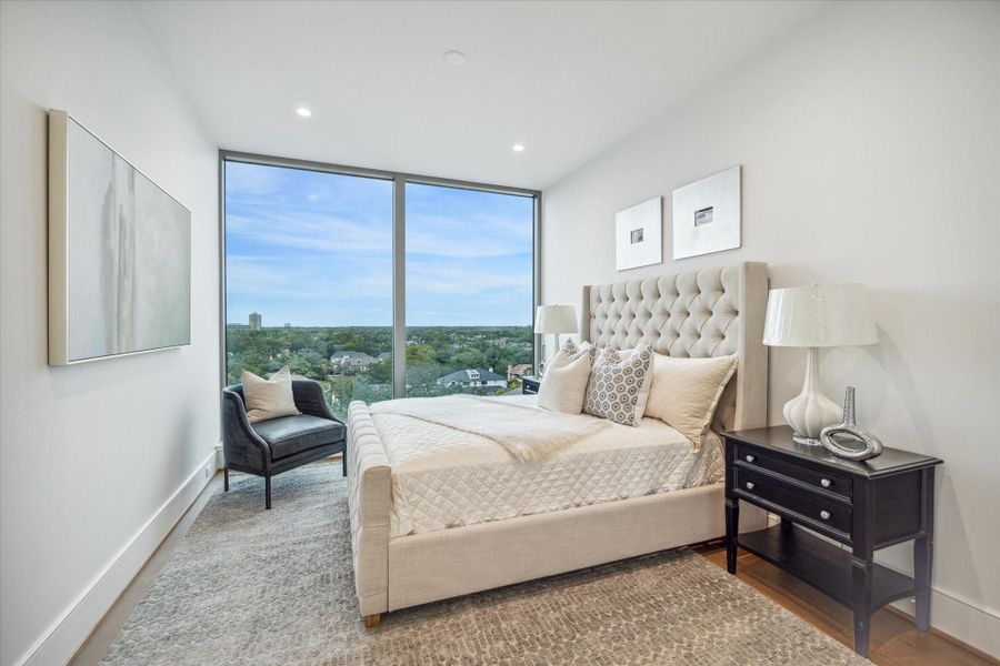 Alternate view of the en-suite guest bedroom with floor-to-ceiling windows and Northern views. Photos are of a similar unit with the same floor plan Alternate view of the en-suite guest bedroom with floor-to-ceiling windows and Northern views. Photos are of a similar unit with the same floor plan