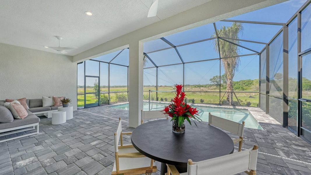 Exterior details and patio area of a home in SkySail Real Estate and Homes for Sale in Naples, FL - Neal Communities, Naples (Image 2).