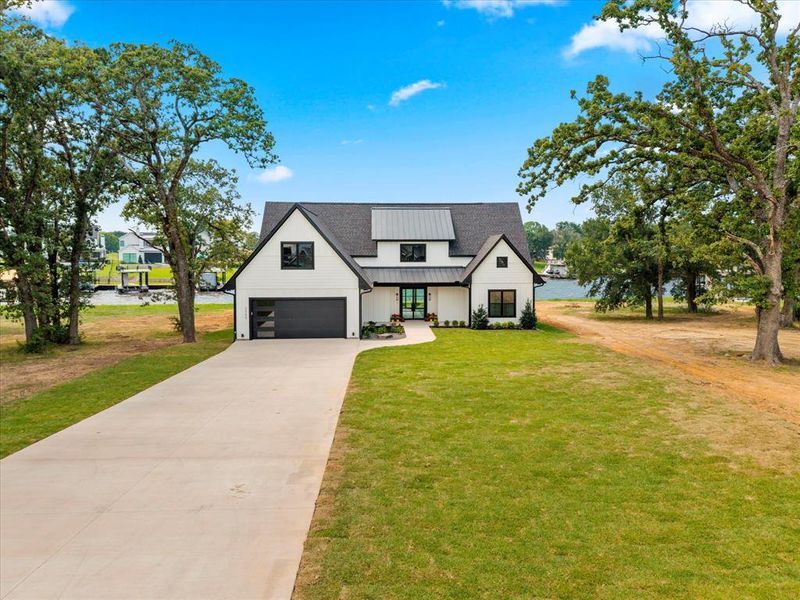 Front exterior of a new home in , Tool, TX, highlighting curb appeal (Image 25). Front exterior of a new home in , Tool, TX, highlighting curb appeal (Image 25).