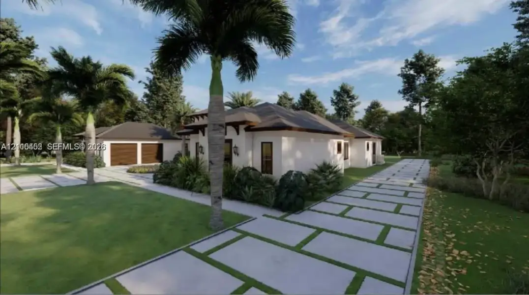 Stucco exterior residence featuring a hip roofline, detached two-car garage, and concrete paver driveway with turf accents Stucco exterior residence featuring a hip roofline, detached two-car garage, and concrete paver driveway with turf accents
