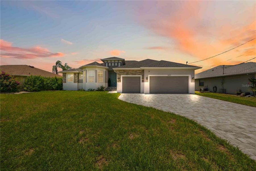 Front exterior of a new home in , Port Charlotte, FL, highlighting curb appeal (Image 2).