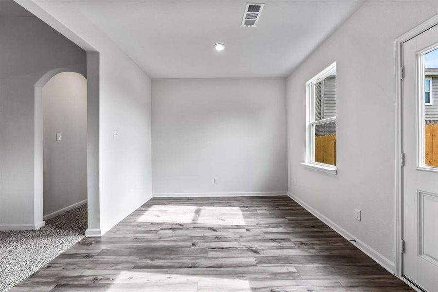 Spare room featuring light wood-type flooring