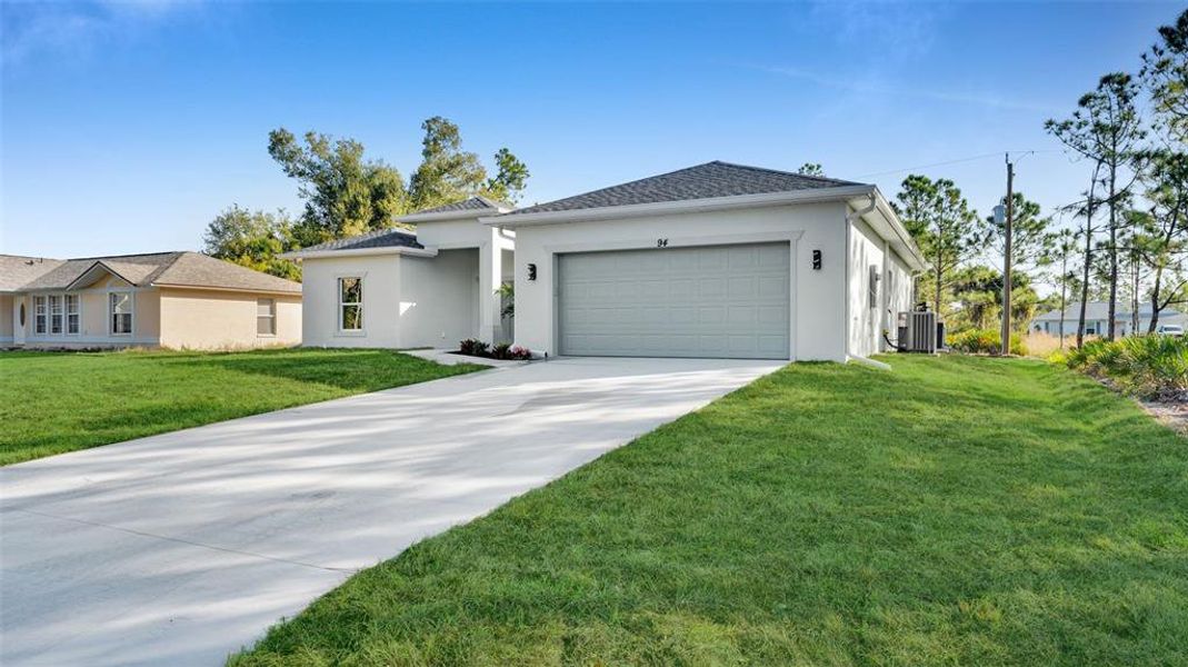 Front exterior of a new home in , Port Charlotte, FL, highlighting curb appeal (Image 17). Front exterior of a new home in , Port Charlotte, FL, highlighting curb appeal (Image 17).