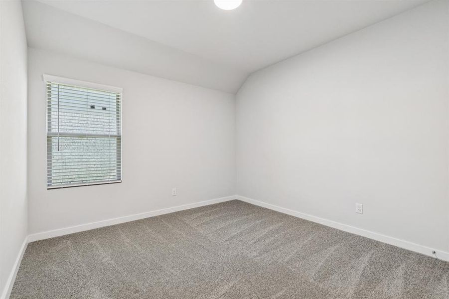 Bedroom in the Oscar home plan by Trophy Signature Homes – REPRESENTATIVE PHOTO