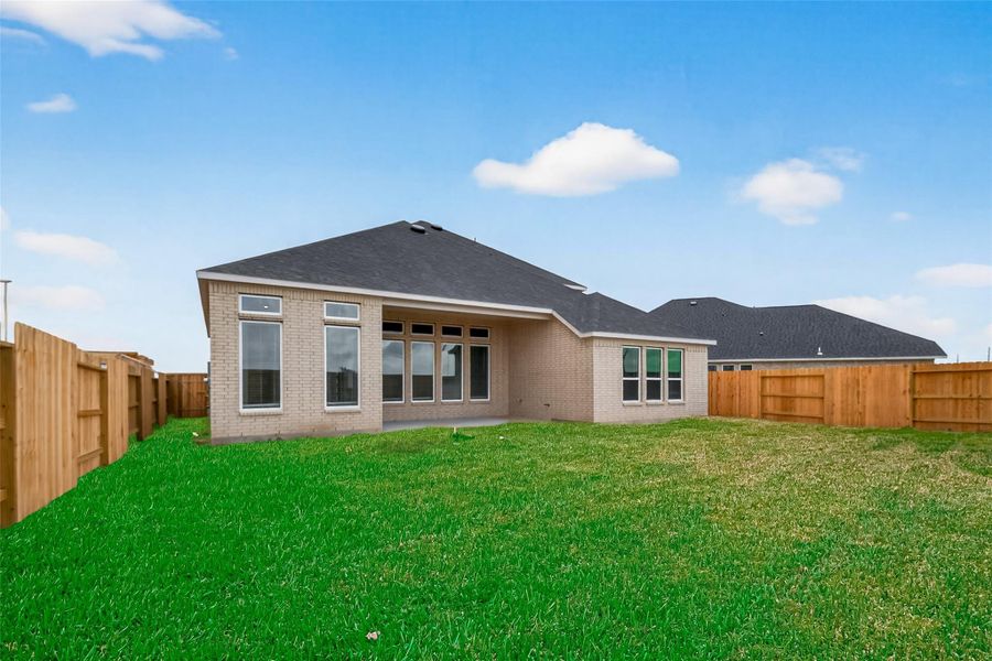 Exterior details and patio area of a home in Rates starting as low as, Iowa Colony (Image 3).