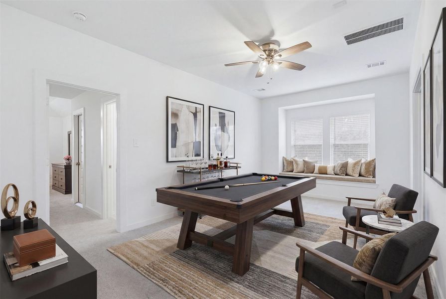 Spacious flex room thoughtfully designed for entertaining and relaxation, featuring a sleek pool table setup, cozy window seating, and abundant natural light. Perfect as a game room, lounge, or secondary living space to fit your lifestyle needs. *virtually staged
