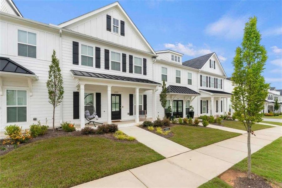 Front exterior of a new home in , Conyers, GA, highlighting curb appeal (Image 22). Front exterior of a new home in , Conyers, GA, highlighting curb appeal (Image 22).
