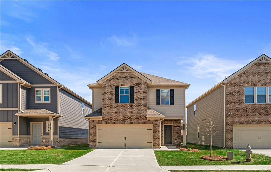 Front exterior of a new home in Towne Center, Hampton, GA, highlighting curb appeal (Image 24).