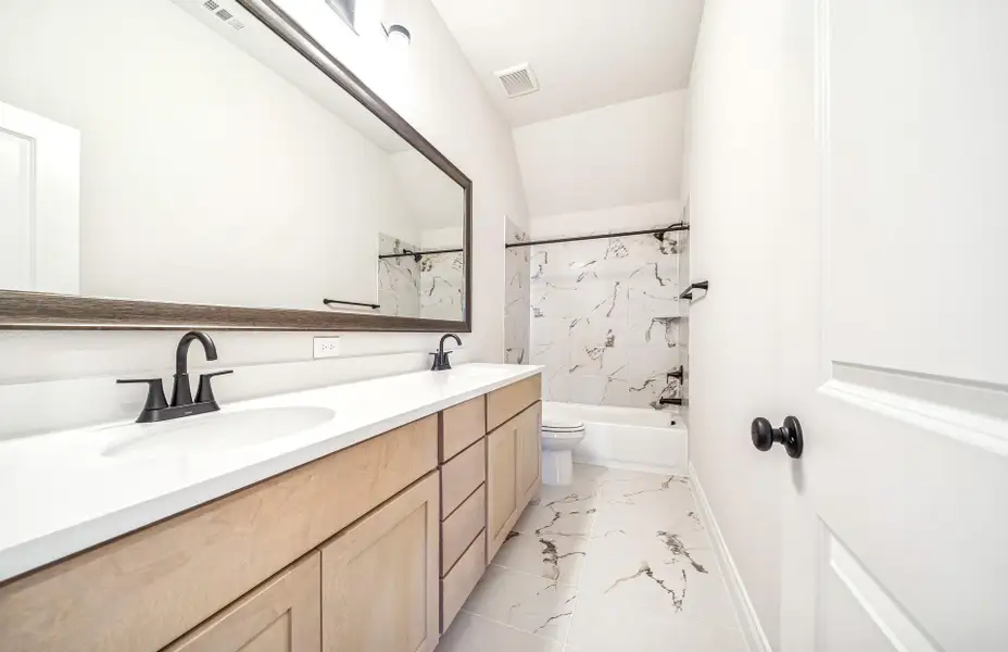 Furnished interior view inside a new home in Bridgeland 60′, Cypress (Image 11).