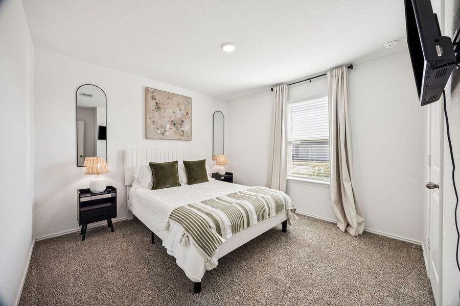 This inviting guest room features a cozy bed, soft lighting, and a serene atmosphere—perfect for relaxation. This inviting guest room features a cozy bed, soft lighting, and a serene atmosphere—perfect for relaxation.