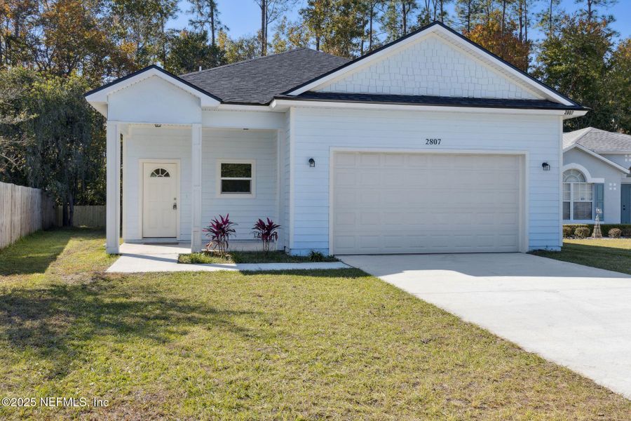 Front exterior of a new home in , Middleburg, FL, highlighting curb appeal (Image 20).