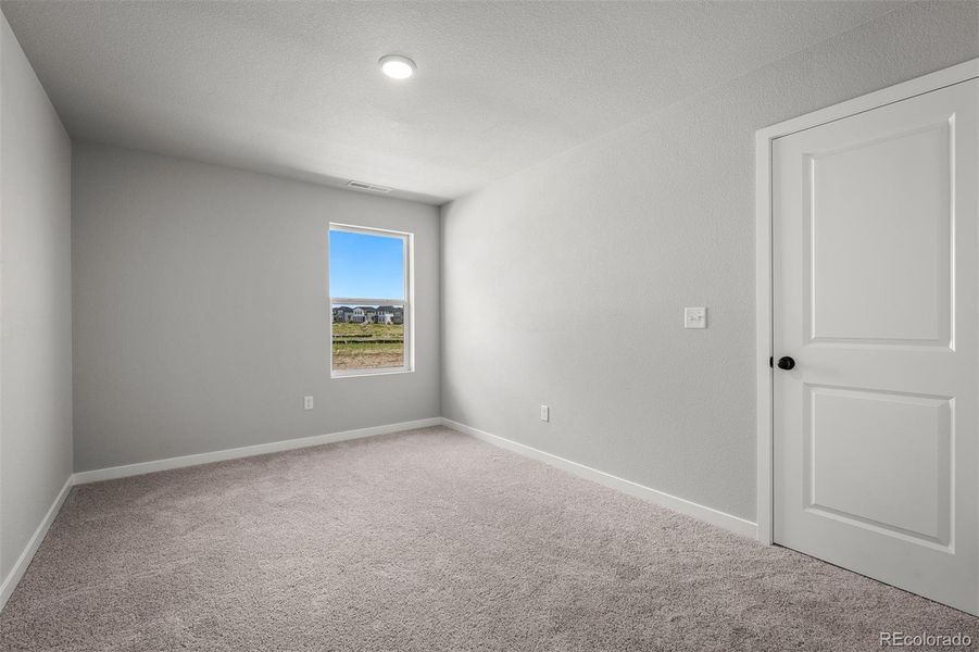 Spacious, unfurnished interior of a new home in Revel Crossing at Wolf Ranch – The Ascent Collection, Colorado Springs (Image 21).
