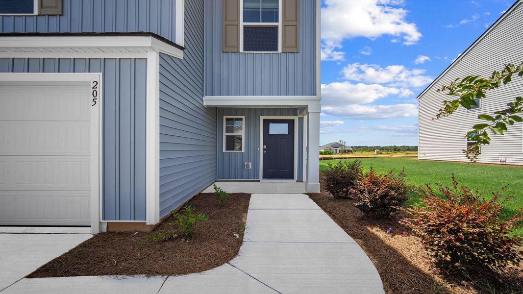 Front exterior of a new home in Holly Oaks, Statesboro, GA, highlighting curb appeal (Image 2). Front exterior of a new home in Holly Oaks, Statesboro, GA, highlighting curb appeal (Image 2).